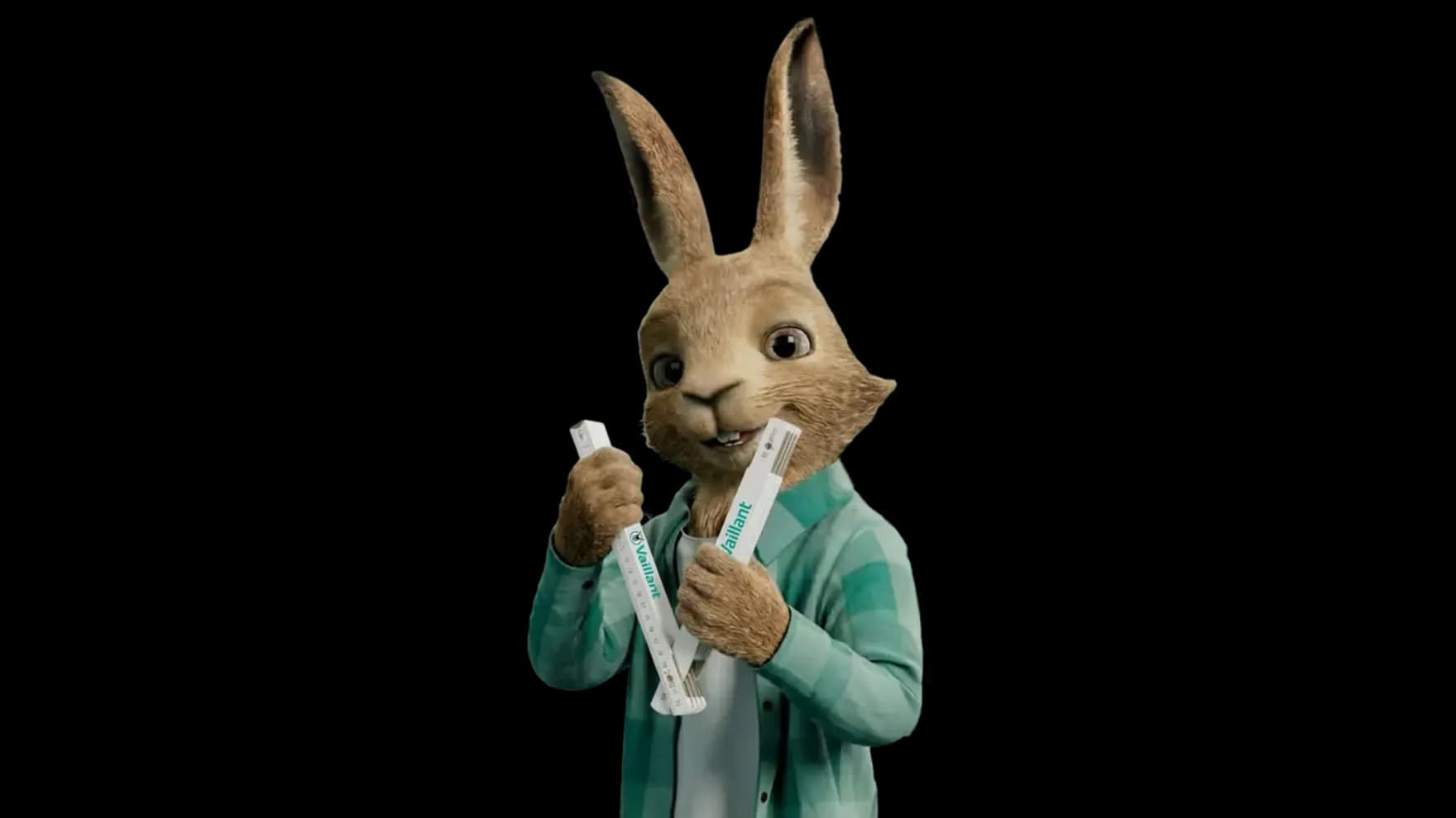 Le lapin tient un mètre pliant dans les mains | Vaillant